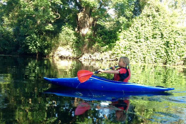 Little girl learning to paddle on River Chelmer